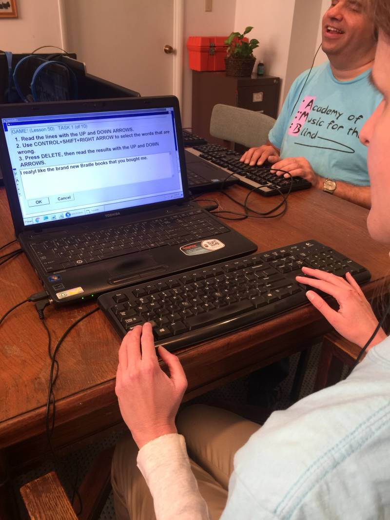 two student having fun typing