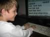 Photo of child typing on a Keyboard