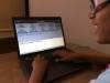 Typing on a laptop